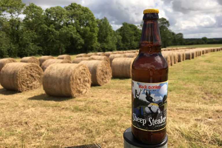 Round bales with sheep stealer farmhouse ale